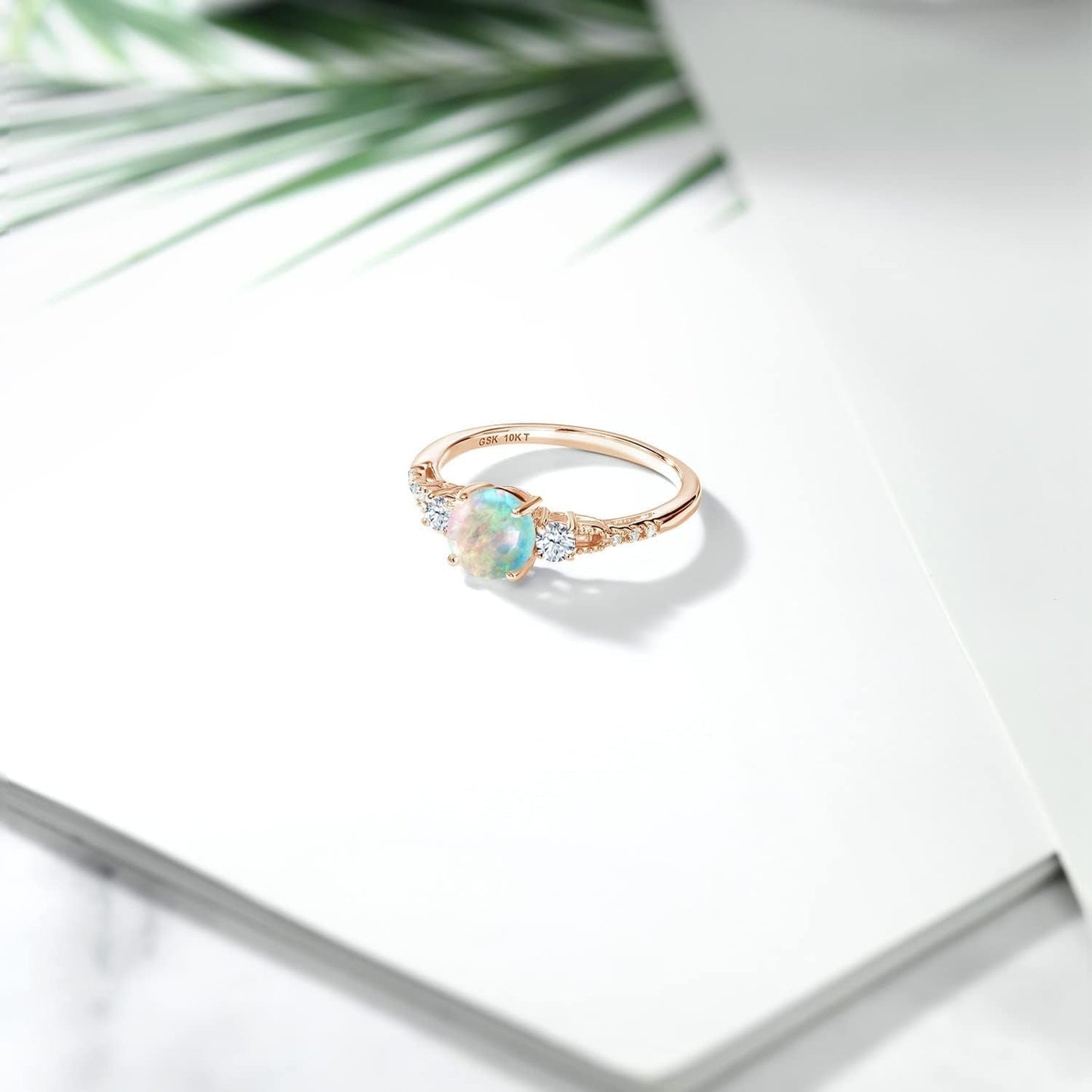 10K Rose Gold White Simulated Opal White Created Sapphire and Diamond Accent 3-Stone Engagement Ring for Women (0.89 Cttw, round Cabochon 6MM, Gemstone October Birthstone)