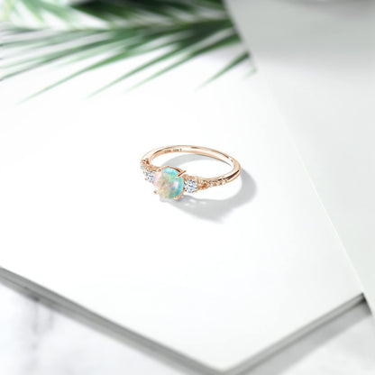 10K Rose Gold White Simulated Opal White Created Sapphire and Diamond Accent 3-Stone Engagement Ring for Women (0.89 Cttw, round Cabochon 6MM, Gemstone October Birthstone)