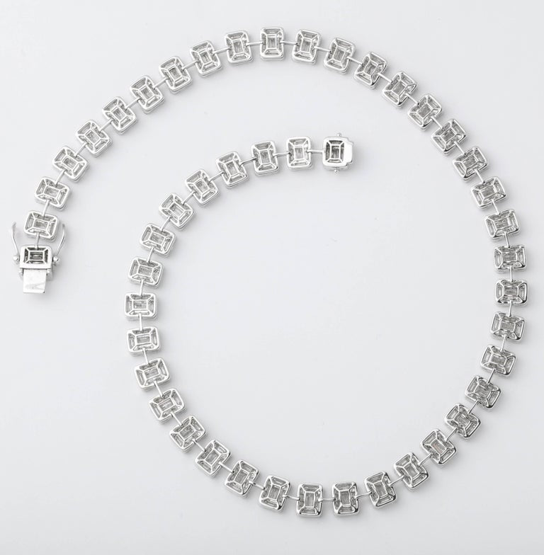 https://a.1stdibscdn.com/emerald-cut-diamond-necklace-illusion-set-for-sale-picture-5/j_415/j_99658421595349090047/6R1A3838_master.jpg?width=768