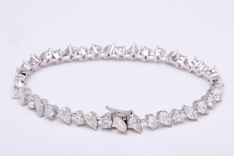 https://a.1stdibscdn.com/multi-shape-diamond-tennis-bracelet-for-sale-picture-5/366869/j_57882221553111221029/6R1A3403_org_master.jpg
