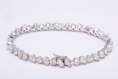 https://a.1stdibscdn.com/multi-shape-diamond-tennis-bracelet-for-sale-picture-5/366869/j_57882221553111221029/6R1A3403_org_master.jpg