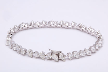 https://a.1stdibscdn.com/multi-shape-diamond-tennis-bracelet-for-sale-picture-5/366869/j_57882221553111221029/6R1A3403_org_master.jpg