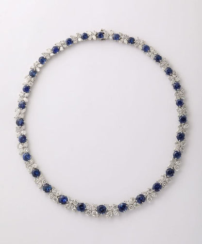 https://a.1stdibscdn.com/blue-sapphire-and-diamond-necklace-for-sale-picture-5/j_415/j_227289521714486587720/2P6A1550_master.jpg?width=768