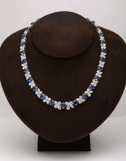 https://a.1stdibscdn.com/blue-sapphire-and-diamond-necklace-for-sale-picture-9/j_415/j_227289521714486592000/2P6A1554_master.jpg?width=768