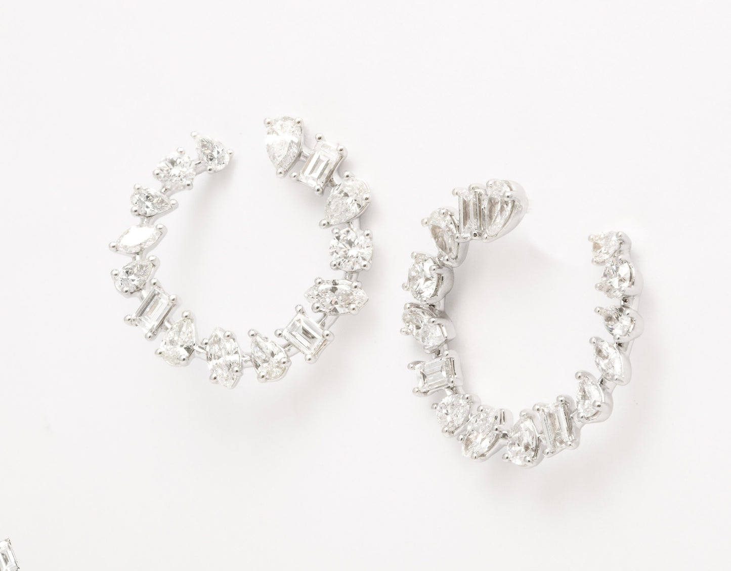 https://a.1stdibscdn.com/multi-shape-diamond-swirl-hoop-earrings-for-sale/1121189/j_122720421620818337167/12272042_master.jpg