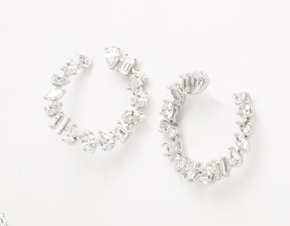 https://a.1stdibscdn.com/multi-shape-diamond-swirl-hoop-earrings-for-sale/1121189/j_122720421620818337167/12272042_master.jpg