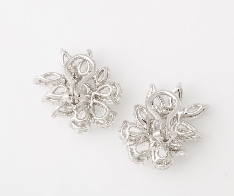 https://a.1stdibscdn.com/diamond-cluster-earrings-for-sale-picture-2/j_415/j_172984621666015948628/6R1A1301_master.jpg?width=768