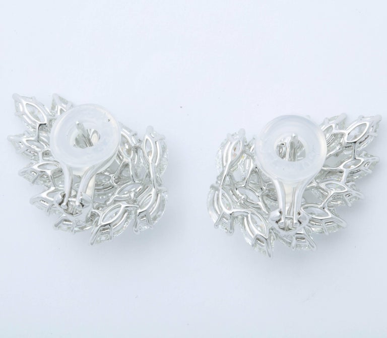 https://a.1stdibscdn.com/diamond-cluster-earrings-for-sale-picture-5/archivesE/upload/0/j_41520831523637148734/6R1A2650_master.jpg?width=768