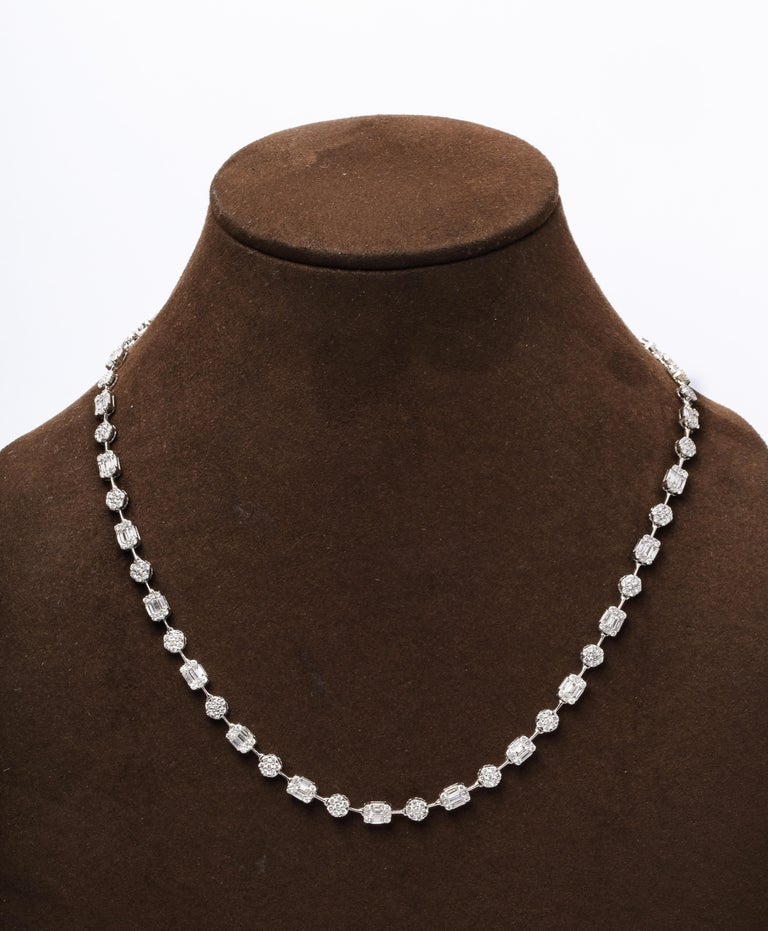https://a.1stdibscdn.com/round-and-emerald-cut-diamond-illusion-set-necklace-for-sale-picture-3/j_415/j_164752621658414300109/6R1A5108_master.jpg?width=768