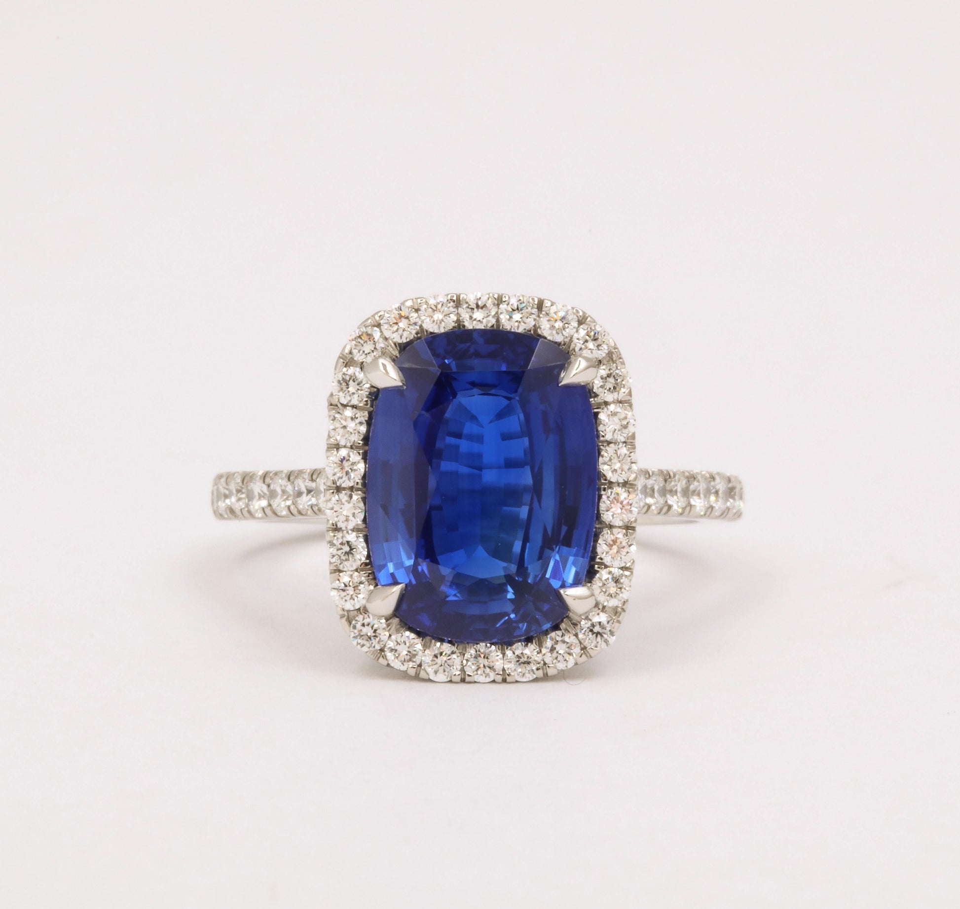https://a.1stdibscdn.com/cushion-cut-blue-sapphire-and-diamond-halo-ring-for-sale-picture-6/j_415/j_194450021685541114340/6R1A5486_master.jpg