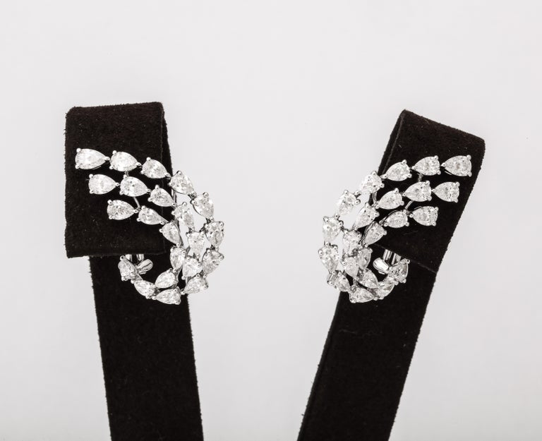 https://a.1stdibscdn.com/diamond-swirl-earrings-for-sale-picture-6/j_415/j_155244021650563395445/6R1A6734_master.jpg?width=768