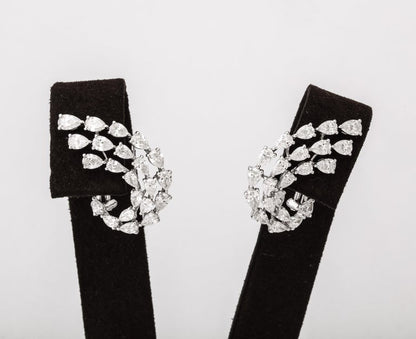 https://a.1stdibscdn.com/diamond-swirl-earrings-for-sale-picture-6/j_415/j_155244021650563395445/6R1A6734_master.jpg?width=768