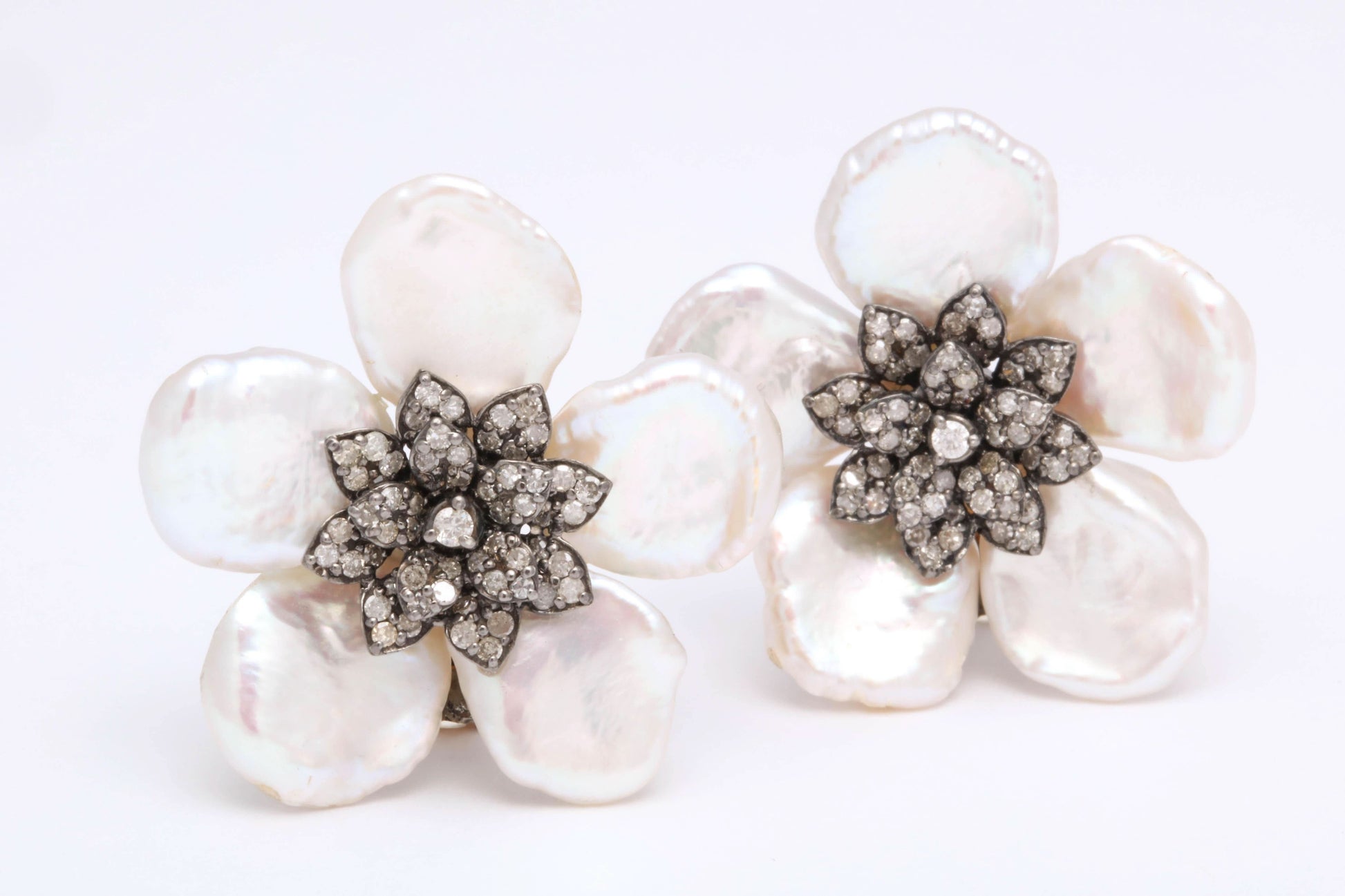 https://a.1stdibscdn.com/pearl-leaf-and-diamond-flower-earring-for-sale-picture-5/j_415/j_130060421628558032950/6R1A7168_master.jpg