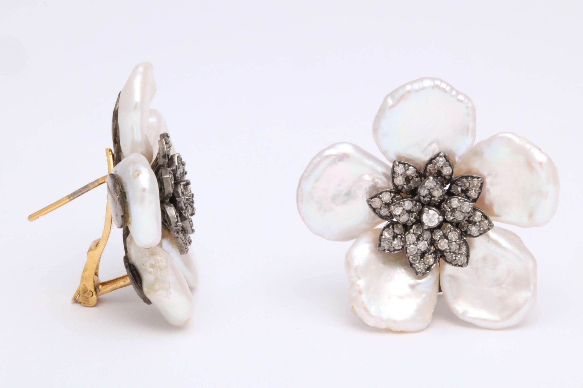 https://a.1stdibscdn.com/pearl-leaf-and-diamond-flower-earring-for-sale-picture-9/j_415/j_130060421628558035024/6R1A7172_master.jpg
