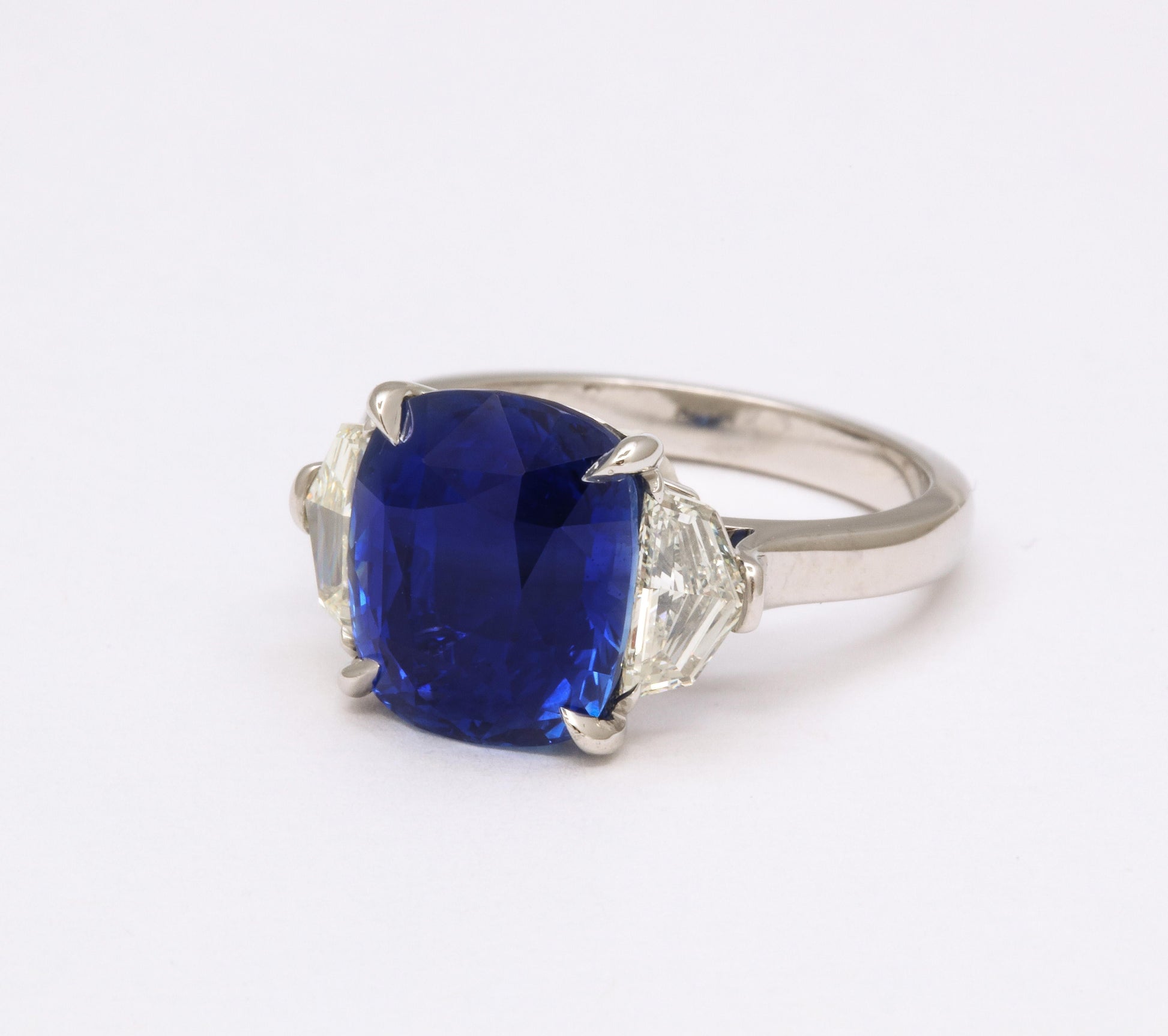 https://a.1stdibscdn.com/7-carat-cushion-cut-sapphire-and-diamond-ring-for-sale-picture-10/j_415/j_144397121641926939753/6R1A8310_master.jpg