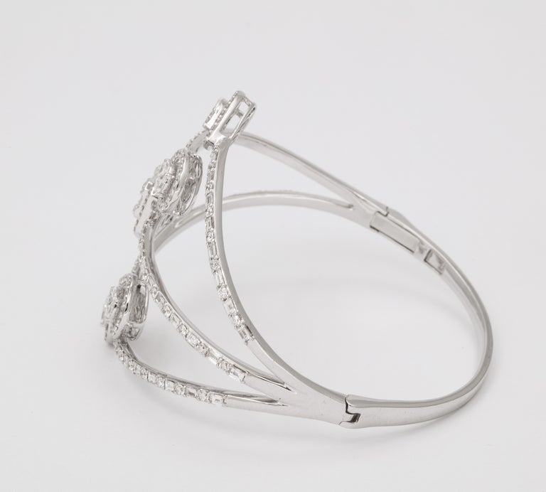 https://a.1stdibscdn.com/multi-shape-diamond-bangle-bracelet-for-sale-picture-9/j_415/j_143753121641493902179/6R1A8499_master.jpg?width=768