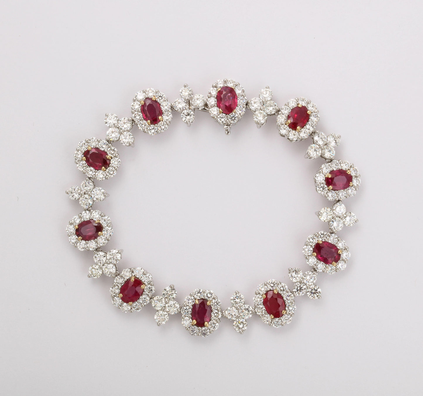 Elegant 9.20ct Oval Ruby and 14.56ct Diamond Platinum Link Bracelet