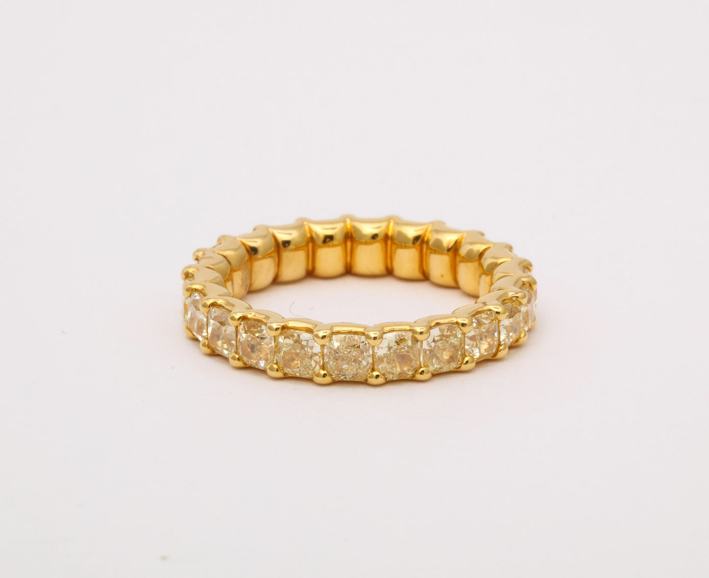 https://a.1stdibscdn.com/yellow-diamond-eternity-band-for-sale-picture-6/j_415/j_202927821694025263679/6R1A8674_master.jpg