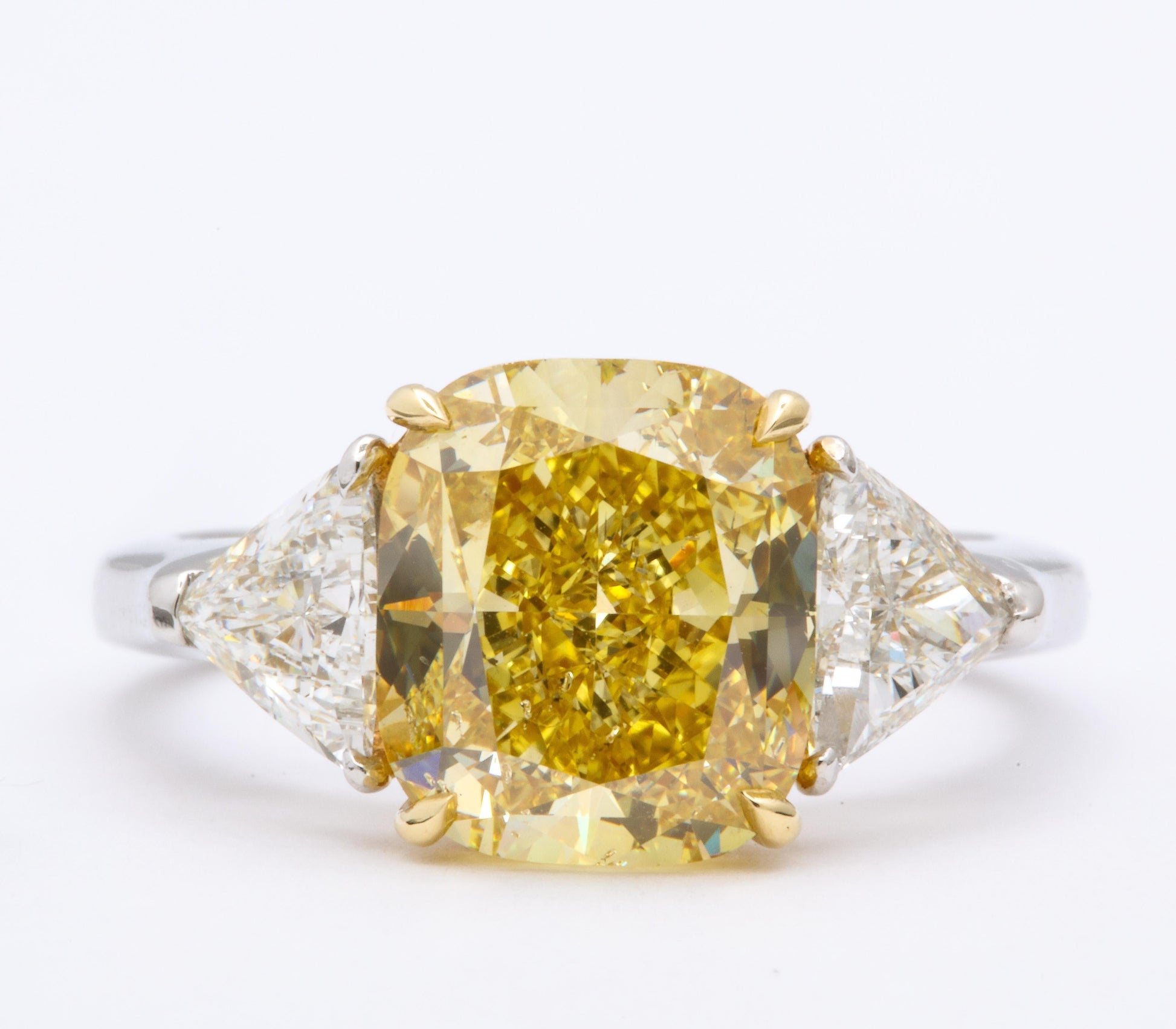 https://a.1stdibscdn.com/gia-certified-4-carat-fancy-intense-yellow-diamond-ring-for-sale-picture-5/j_415/1598973568687/6R1A9303_master.jpg