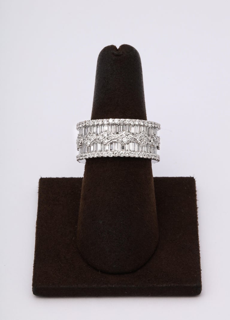 https://a.1stdibscdn.com/wide-baguette-and-round-diamond-band-for-sale-picture-8/j_415/1606754944782/6R1A9895_master.jpg?width=768