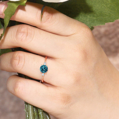 10K Rose Gold London Blue Topaz and White Created Sapphire Solitaire Engagement Ring for Women (0.78 Cttw, round 6MM, Gemstone November Birthstone, Available in Size 5,6,7,8,9)