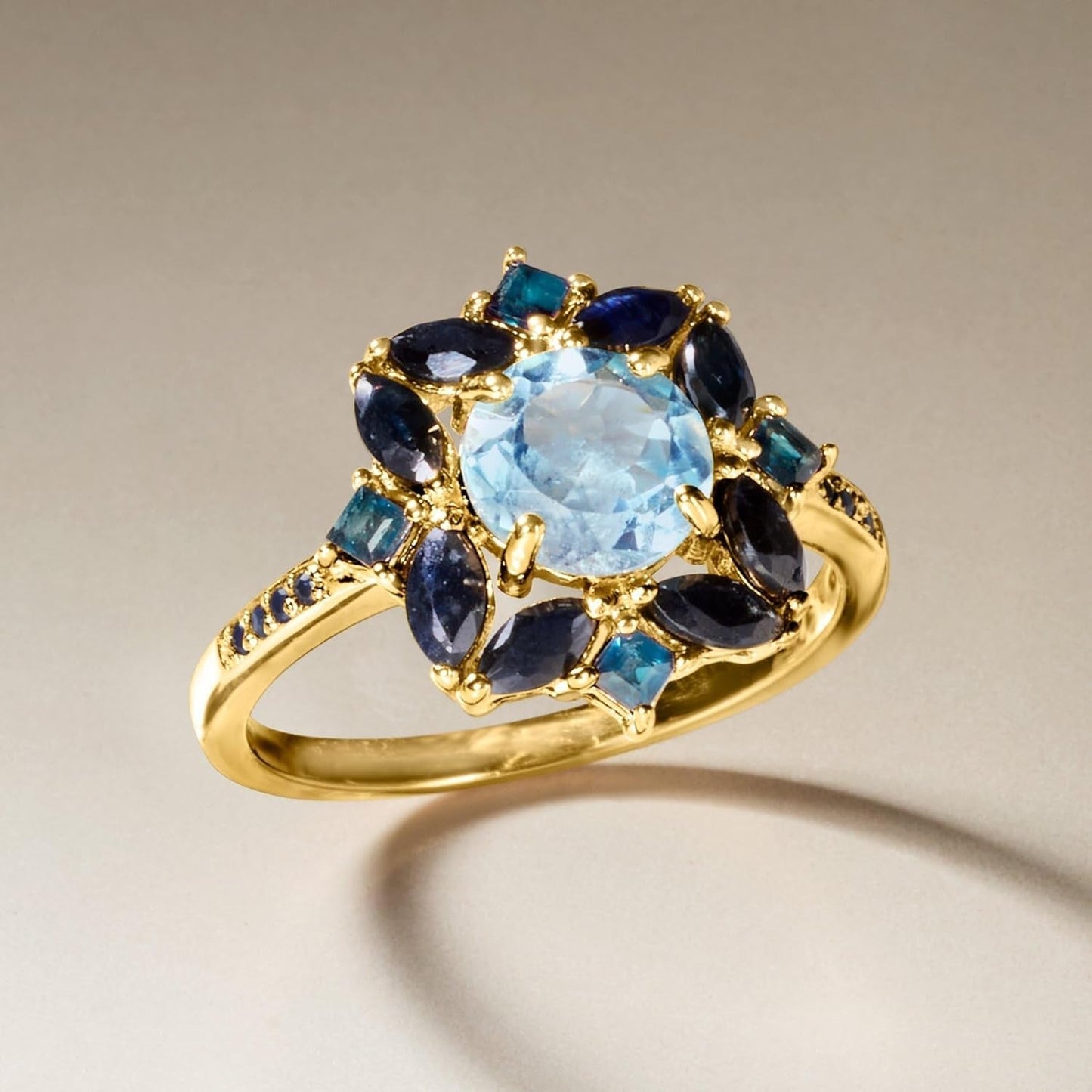1.80 Carat Sky Blue Topaz, 2.40 Ct. T.W. Sapphire and .80 Ct. T.W. London Blue Topaz Ring in 18Kt Gold over Sterling. Size 7