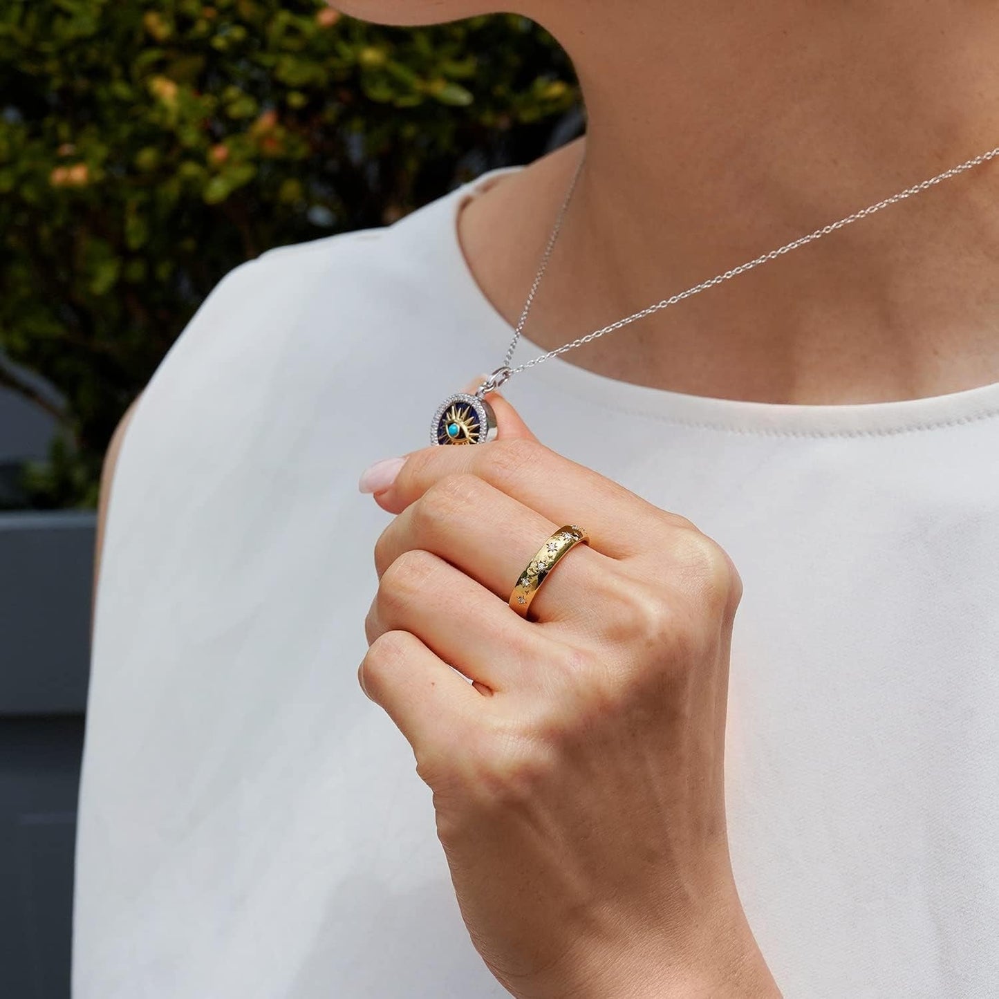 Hallmark Fine Jewelry Sterling Silver and 14K Yellow Gold with 1/6 Cttw Natural White round Diamonds with 13MM Lapis and 2MM Synthetic Turquoise Evil Eye Pendant Necklace, 18" Cable Chain