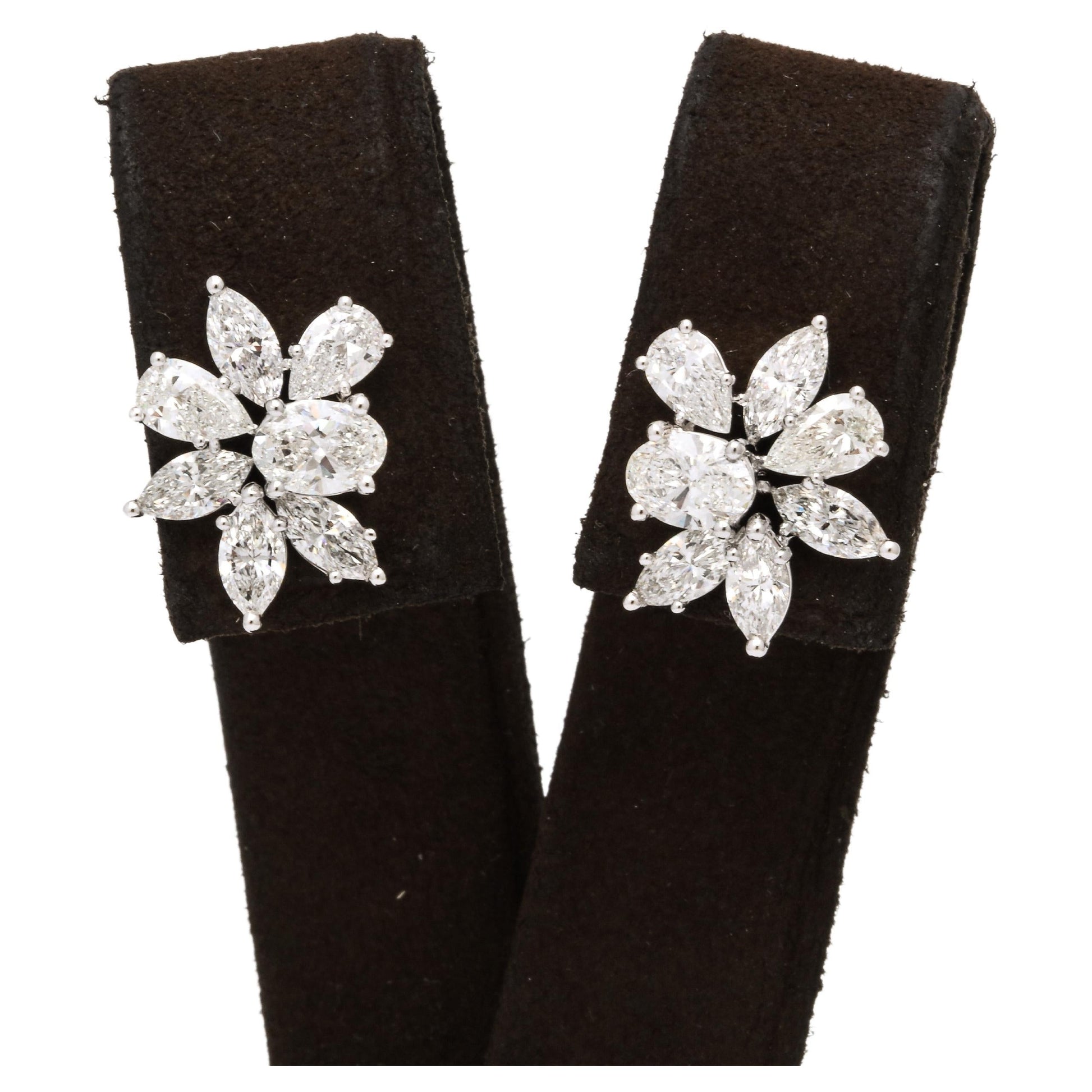 https://a.1stdibscdn.com/diamond-cluster-earrings-for-sale/j_415/j_141445021639062275454/j_14144502_1639062276697_bg_processed.jpg