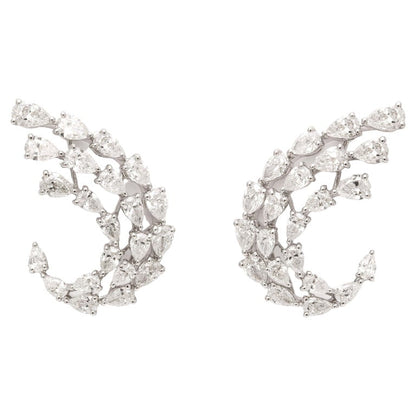 https://a.1stdibscdn.com/diamond-swirl-earrings-for-sale/j_415/j_155244021650563373178/j_15524402_1650563374436_bg_processed.jpg?width=768