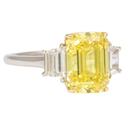 https://a.1stdibscdn.com/fancy-vivid-yellow-emerald-cut-ring-for-sale/j_415/j_174482921667400138155/j_17448292_1667400138733_bg_processed.jpg?width=768